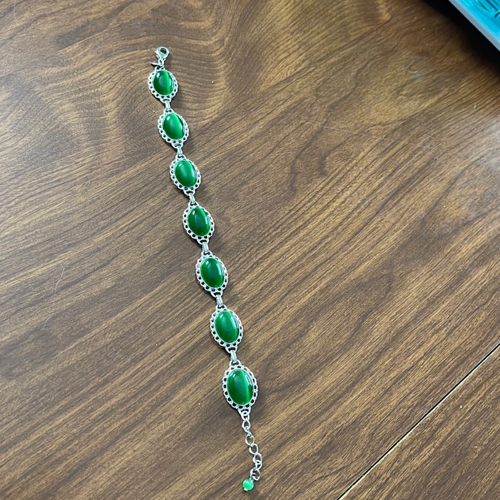 Bracelet silver tone with green/emerald colored stones